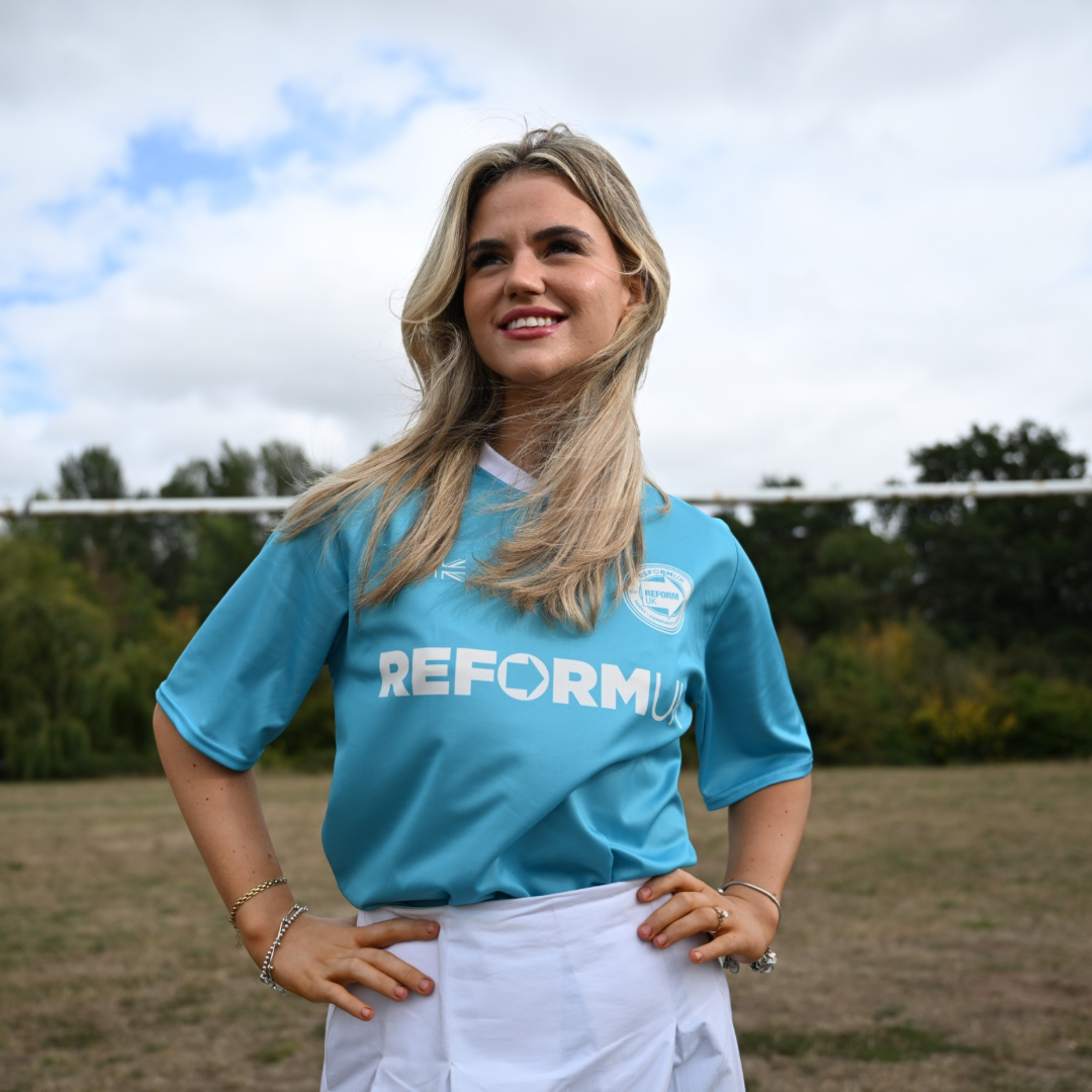 Woman wearing a blue 'REFORMFC Original Shirt'